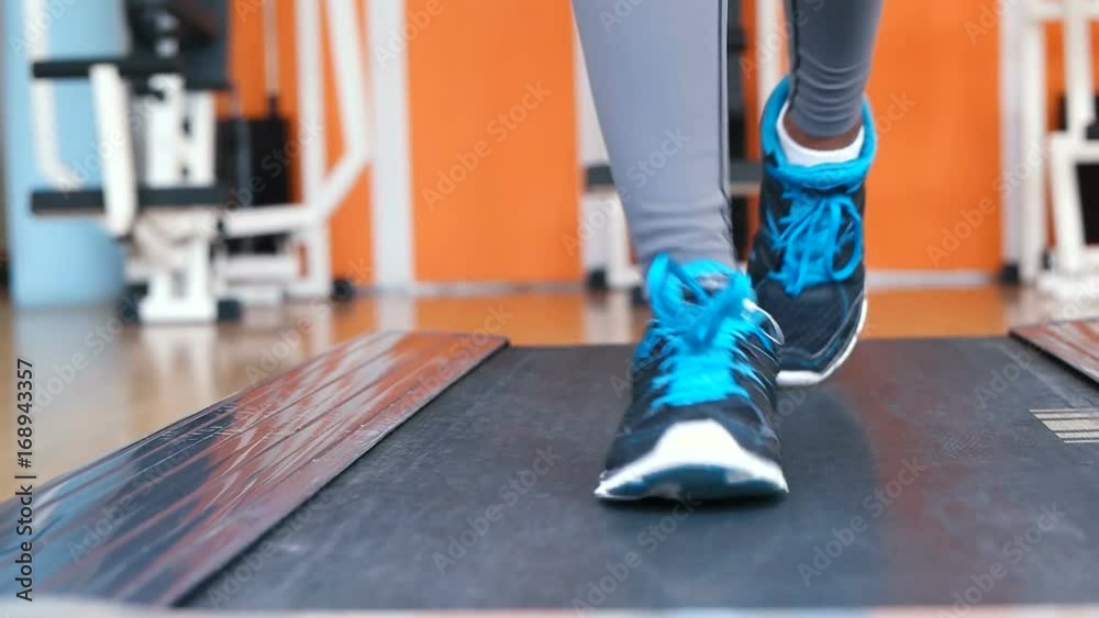 afro american woman running on treadmill