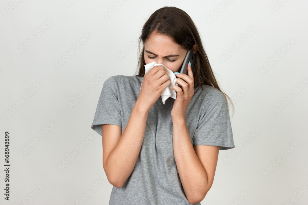 Portrait of a pretty woman having flu. Girl blowing nose. Portrait of a pretty woman having flu. Girl blowing nose.