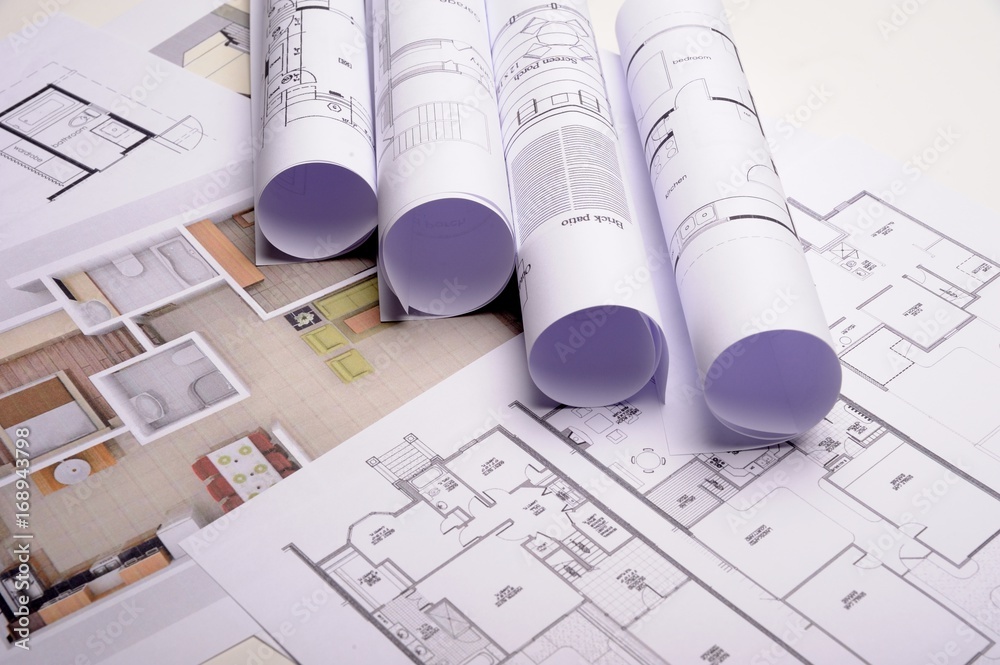 Architect rolls and plans construction project drawing Architect rolls and plans construction project drawing