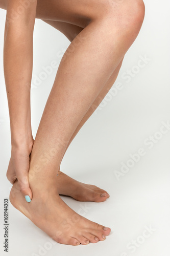 Woman with pain in her knee. Pain concept close-up