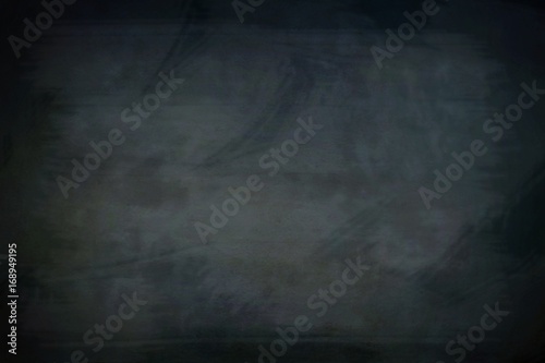Abstract Chalk rubbed out on blackboard with education concepts