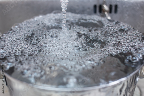 clean rinse water in the kitchen sink photo