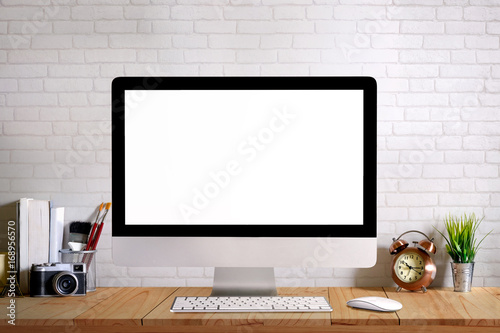 Desk space modern home decor mock up desktop computer with camera, dummy, houseplant. Artist workspace. Blank screen for graphics display montage.