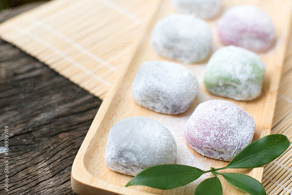 Daifuku Mochi Japanese desert in a tray on the wooden table Daifuku Mochi Japanese desert in a tray on the wooden table