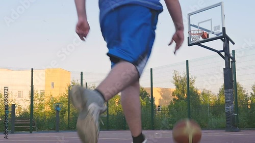 Young Guy Play Street Basketball photo