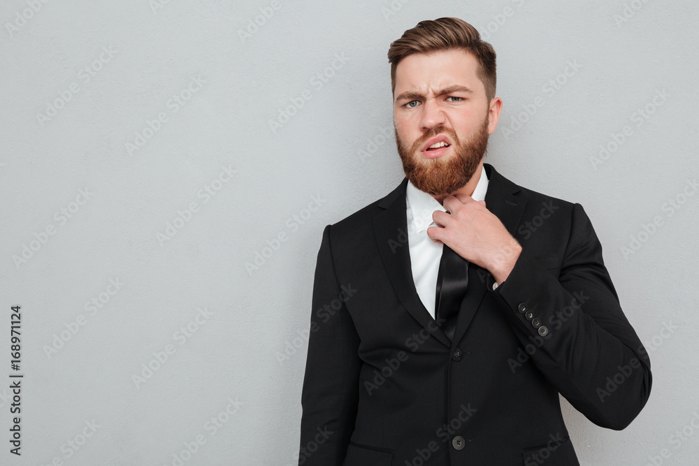Displeased bearded man in suit Displeased bearded man in suit