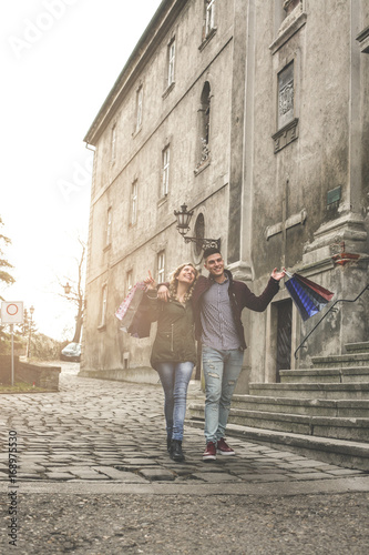 Couple in shopping together. Happy couple shopping together and having fun