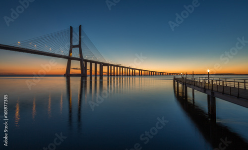 Sunrise in Lisbon, under the Vasco da Gama Bridge, portugal © Paulo