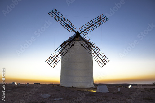 Illuminated traditional windmill at rising
