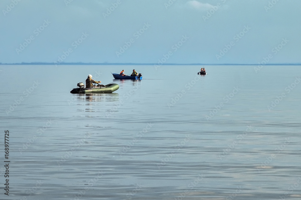 fishermen in rubber boats