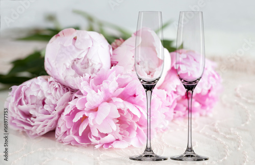 Mockup - 2 champagne glasses, with peonies behind, next to flower arrangement, perfect for businesses who sell decals, vinyl stickers, just overlay your design