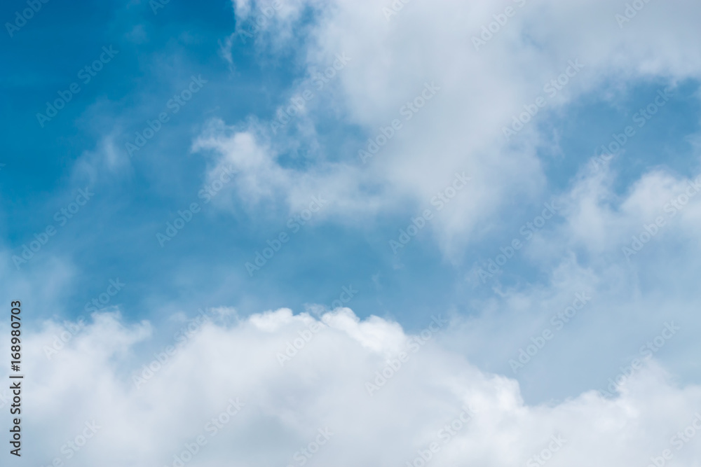 Clouds are divided into layers in the evening with light.