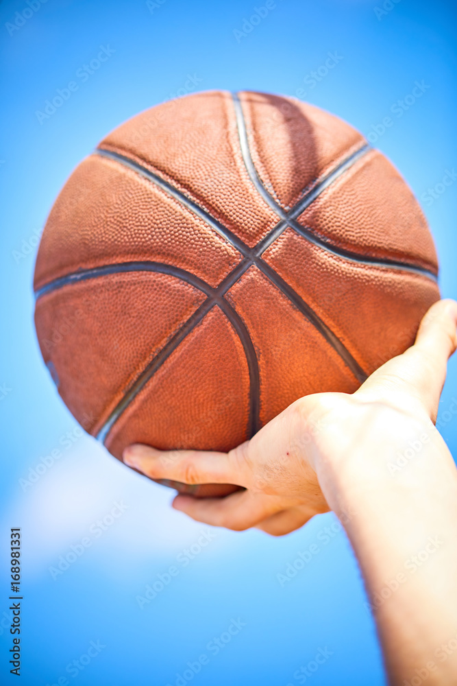 Fototapeta premium man holding a basketball