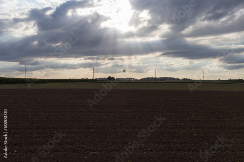 road on august summer evening with contrastful cloudy sky photo