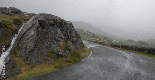 Desolate mountainroad Ireland. Pass. Foggy road. Westcoast Ireland. Mountains. County of Cork photo