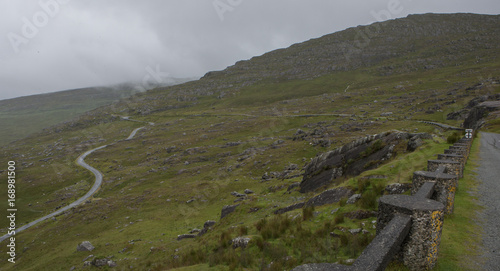 Desolate mountainroad Ireland. Pass. Foggy road. Westcoast Ireland. Mountains. County of Cork photo