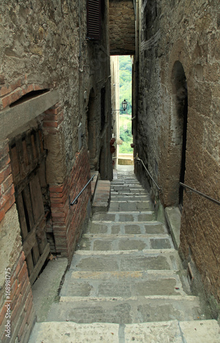 narrow street with old stone steps  Italy