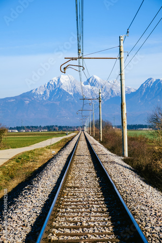 Railroad on Sorsko feld and Kamnik Savinja alps in the background.