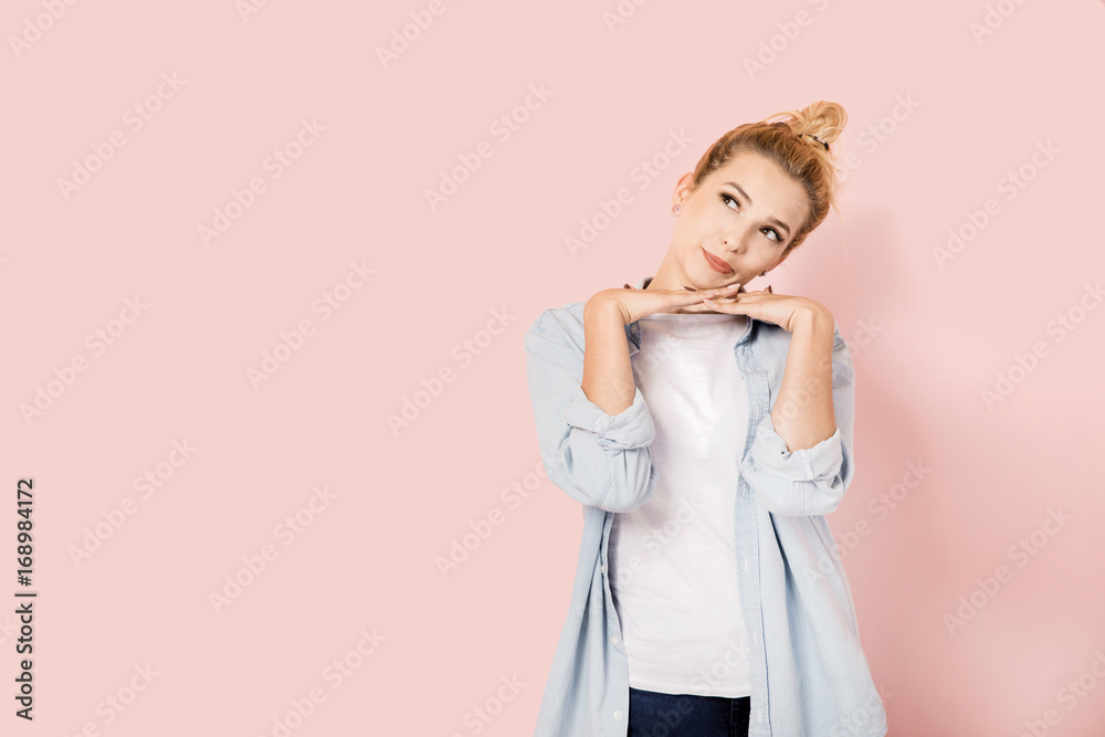 Pretty blonde woman on pink background with copyspace Pretty blonde woman on pink background with copyspace