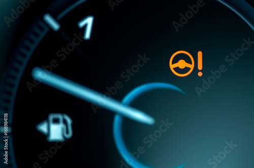 Warning light icon in car dashboard. Power steering failure