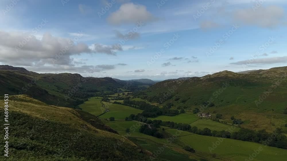 Aerial view of a green valley in Cumbria, UK. Aerial view of a green valley in Cumbria, UK.