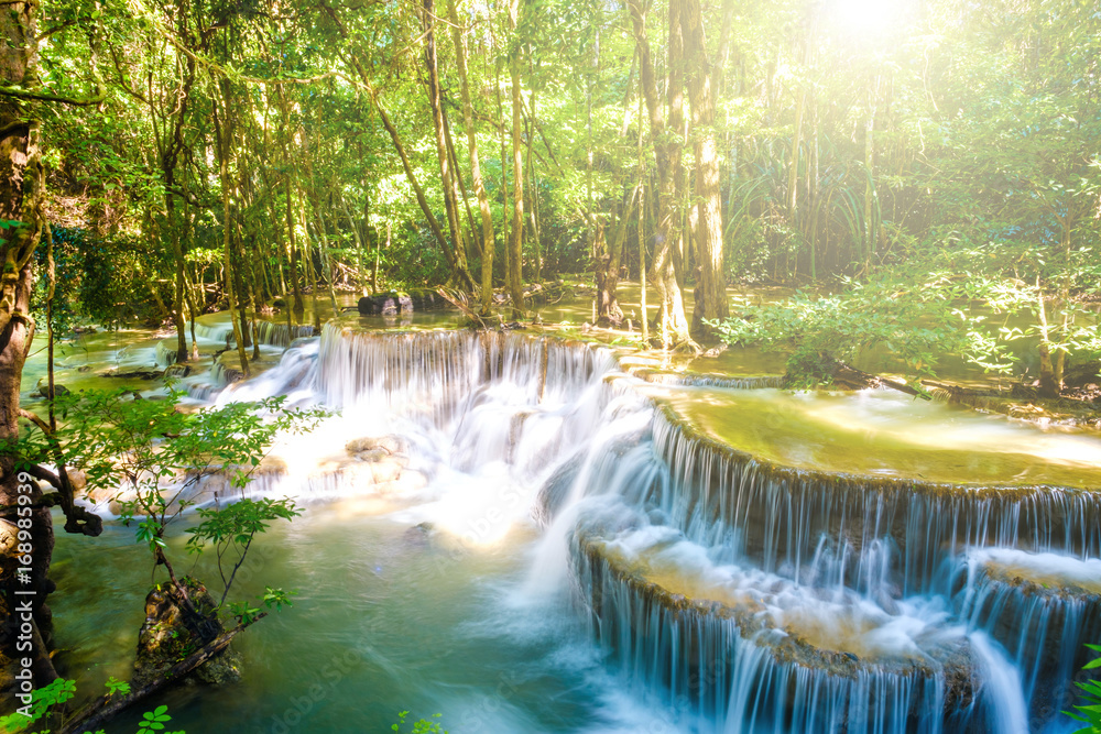 water fall with sun shine kanchanaburi thailand