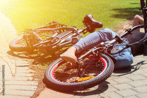 A woman fell with her bicycle in the park