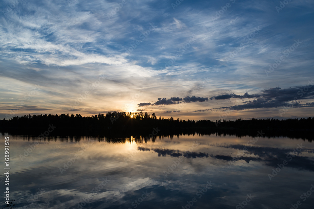 Midnight sun in Lapland.Peaceful lake view.