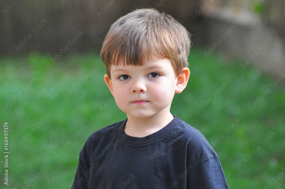 Four years old boy portrait. Child portrait outside