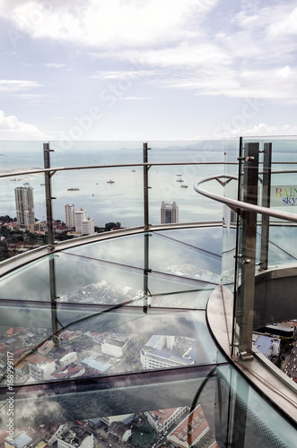 Skywalk with transparent glass floor at the 66th floor and aerial view of Penang island from the Komtar Tower, Penang, Malaysia
