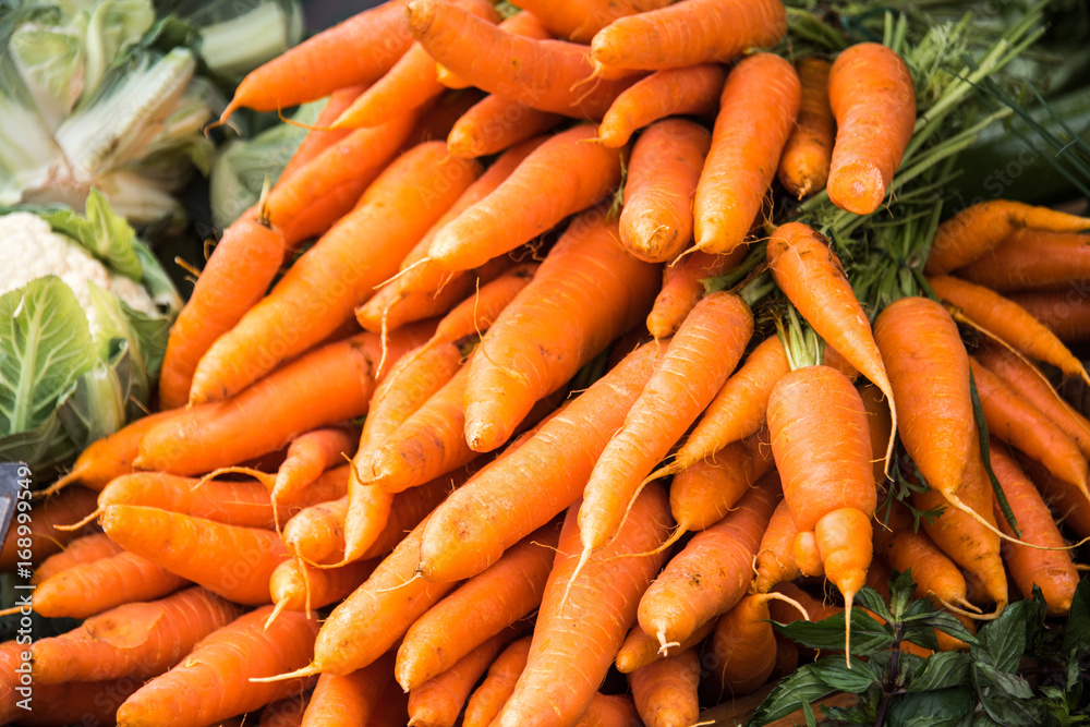 Fresh organic heirloom carrots at farmers market Fresh organic heirloom carrots at farmers market