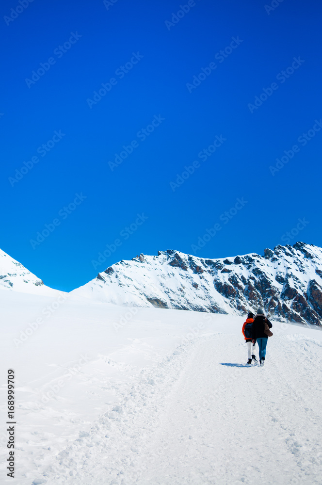 Tourists trekking at Jungfrau, Swiss Alps of Switzerland.