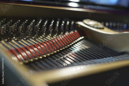Piano chords and hammers from the inside © stockcondor