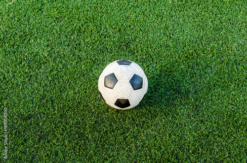 Soccer Football on the green grass of Soccer field.