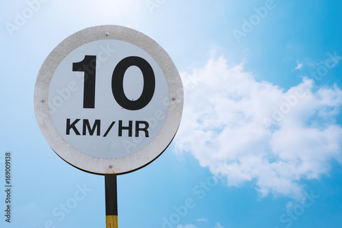 The old speed limit sign not over 10 kilometer per hour on blue sky background with clipping path included