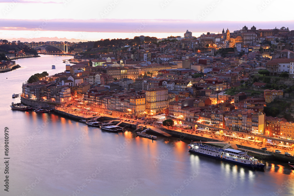 Porto skyline and Douro River illuminated at night, Portugal