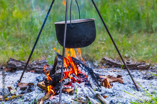 closeup touristic cauldron in a camp fire