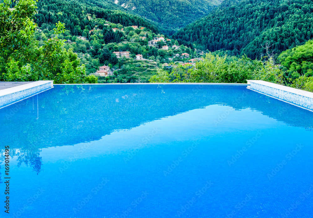 Swimming pool with fantastic view to Zarouhla village which located  in Greece