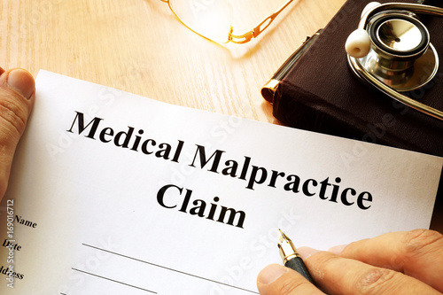 Medical Malpractice Claim on a table. photo