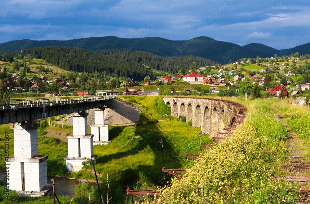 Old and new railway bridges, old viaduct Vorohta, Ukraine. Carpathian Mountains, wild mountain landscape