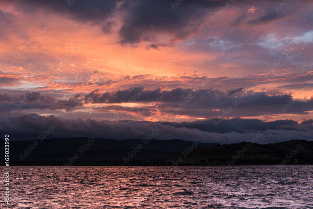 Dramatic cloudy sunset on a lake