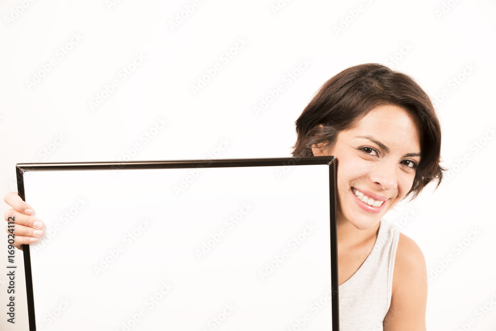 Beautiful young woman holding a blank sheet of paper Beautiful young woman holding a blank sheet of paper