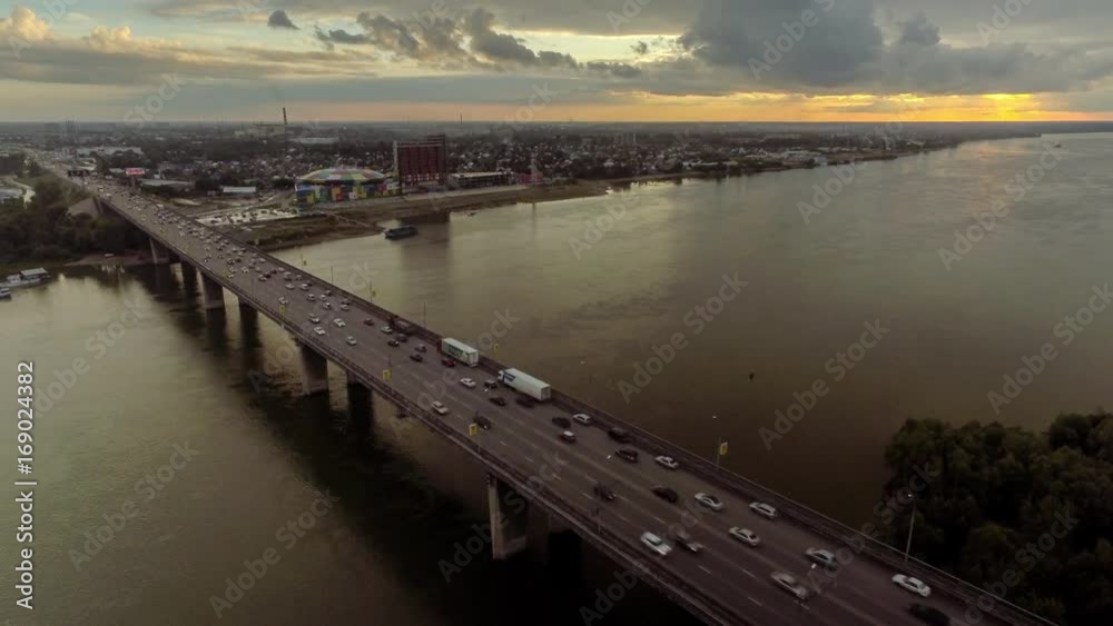 Aerial view with traffic jam on bridge over the river Aerial view with traffic jam on bridge over the river