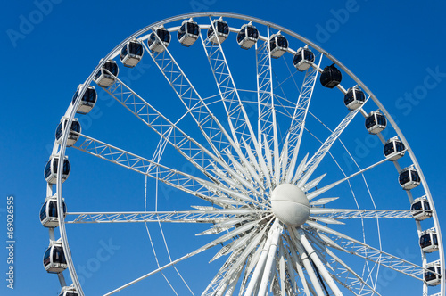 Giant ferris wheel on clear blue sky background in Gdansk  Poland