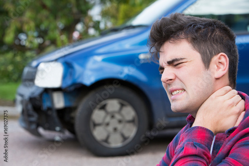 Foto Male Motorist Suffering From Whiplash After Car Accident