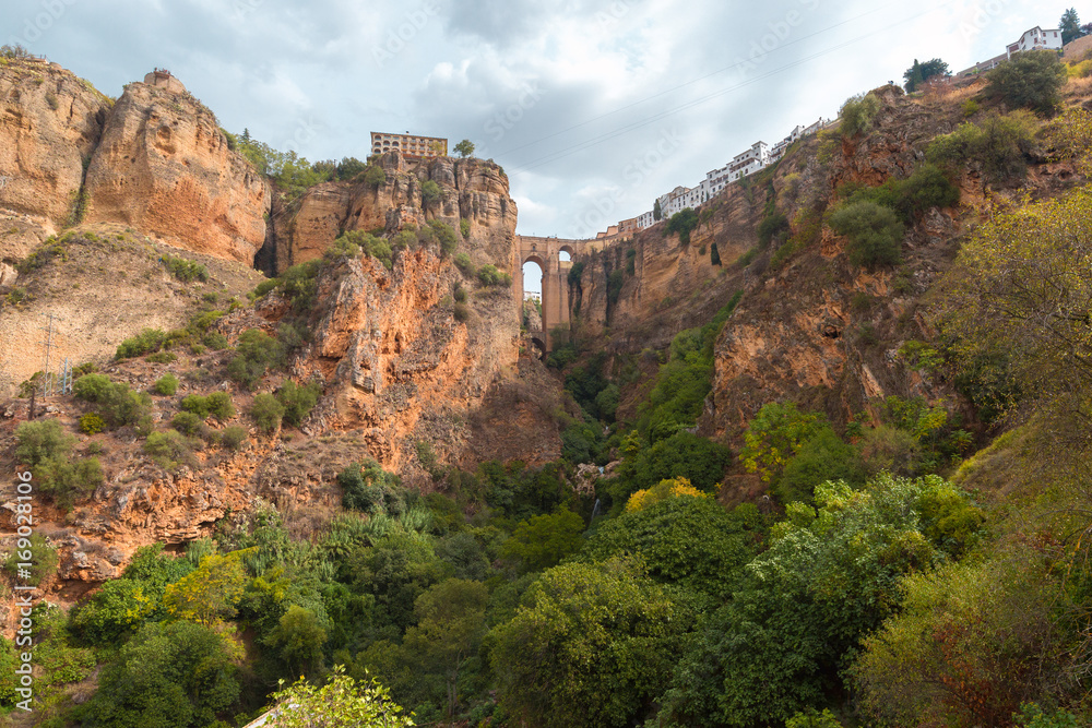 Panorama of Ronda, mountains and Puente Nuevo or New Bridge, over the Tajo Gorge, Andalusia, Spain