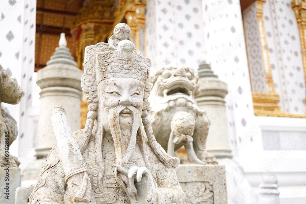 Chinese ship ballast stone figurines or Junk (ship) at Wat Arun Ratchawararam Ratchaworamahawihan (Wat Arun), Chao Phraya Riverside, Bangkok Thailand . One of the most attractive temples in Thailand.