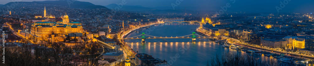 Budapest, Hungary - Panoramic skyline view of Budapest with Historic Royal Palace, Matthias Church, Szechenyi Chain Bridge, St. Stephen's Basilica and Parliament of Hungary at blue hour