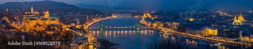 Budapest, Hungary - Panoramic skyline view of Budapest with Historic Royal Palace, Matthias Church, Szechenyi Chain Bridge, St. Stephen's Basilica and Parliament of Hungary at blue hour