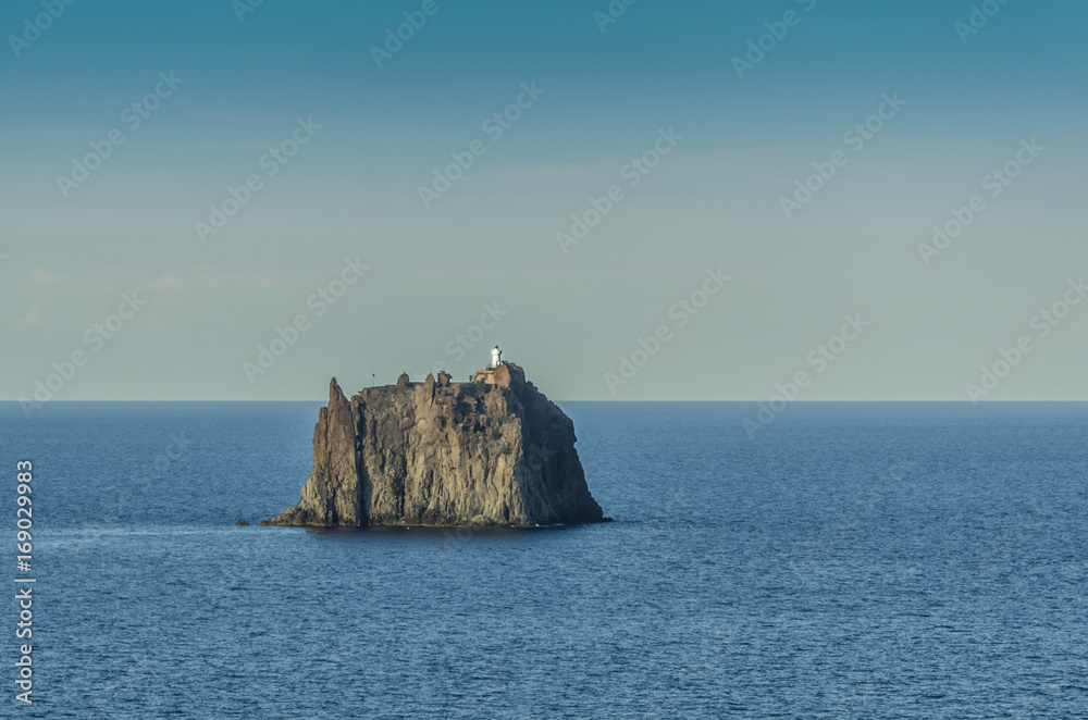 Pebble strombolicchio in front of stromboli island Pebble strombolicchio in front of stromboli island